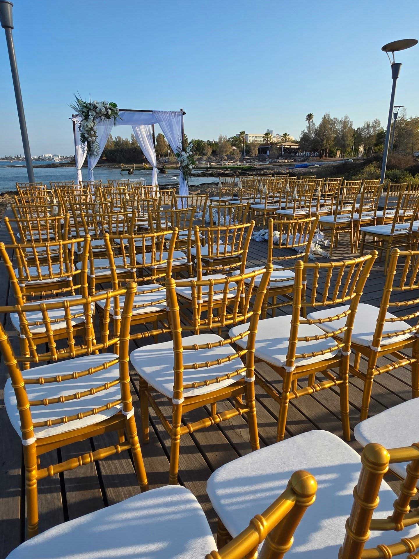 deck-of-gold-chiavari-chairs-with-tent-at-peer deck of gold chiavari chairs with tent at peer