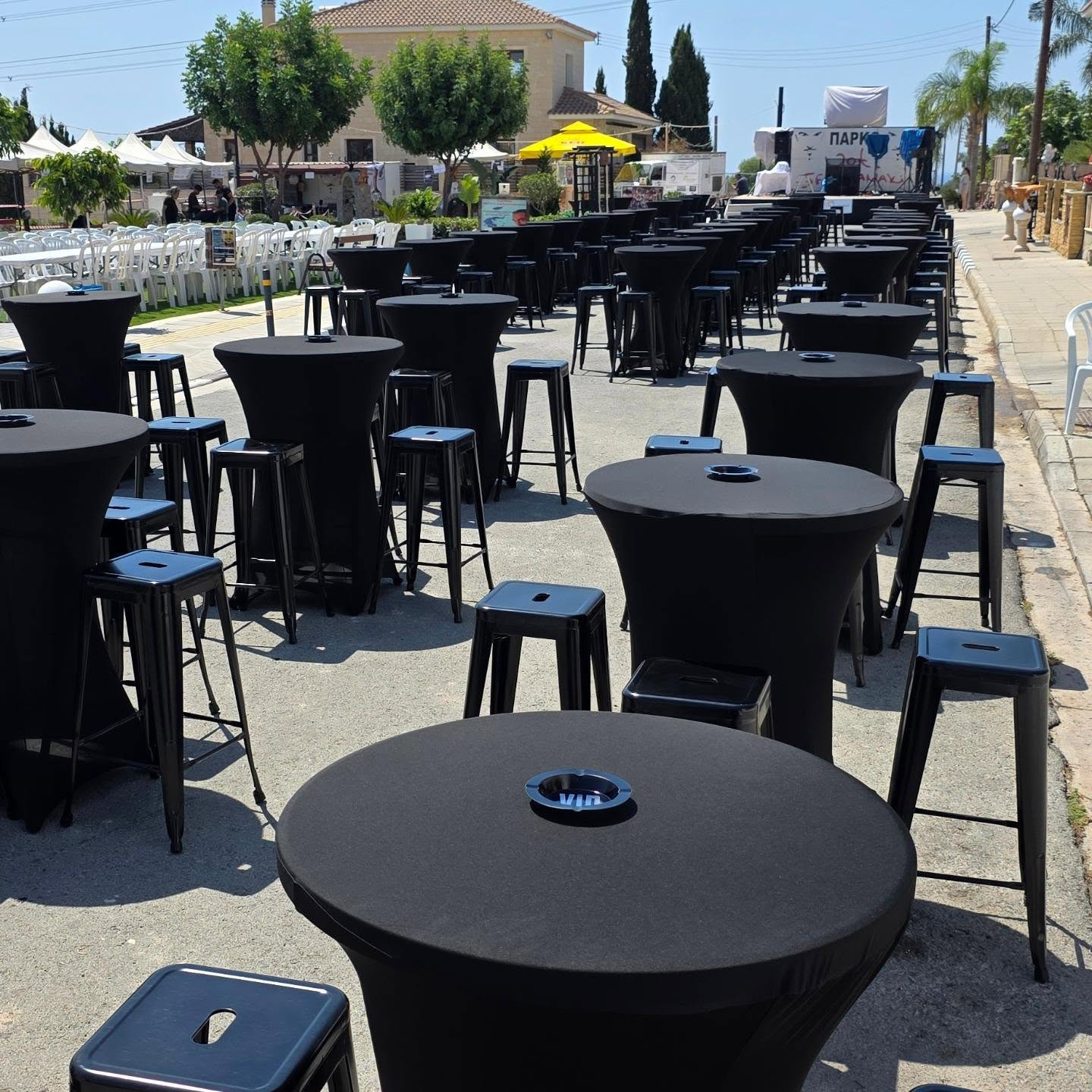 round-high-tables-with-black-cover-plastic-stools round high tables with black covers and plastic stools
